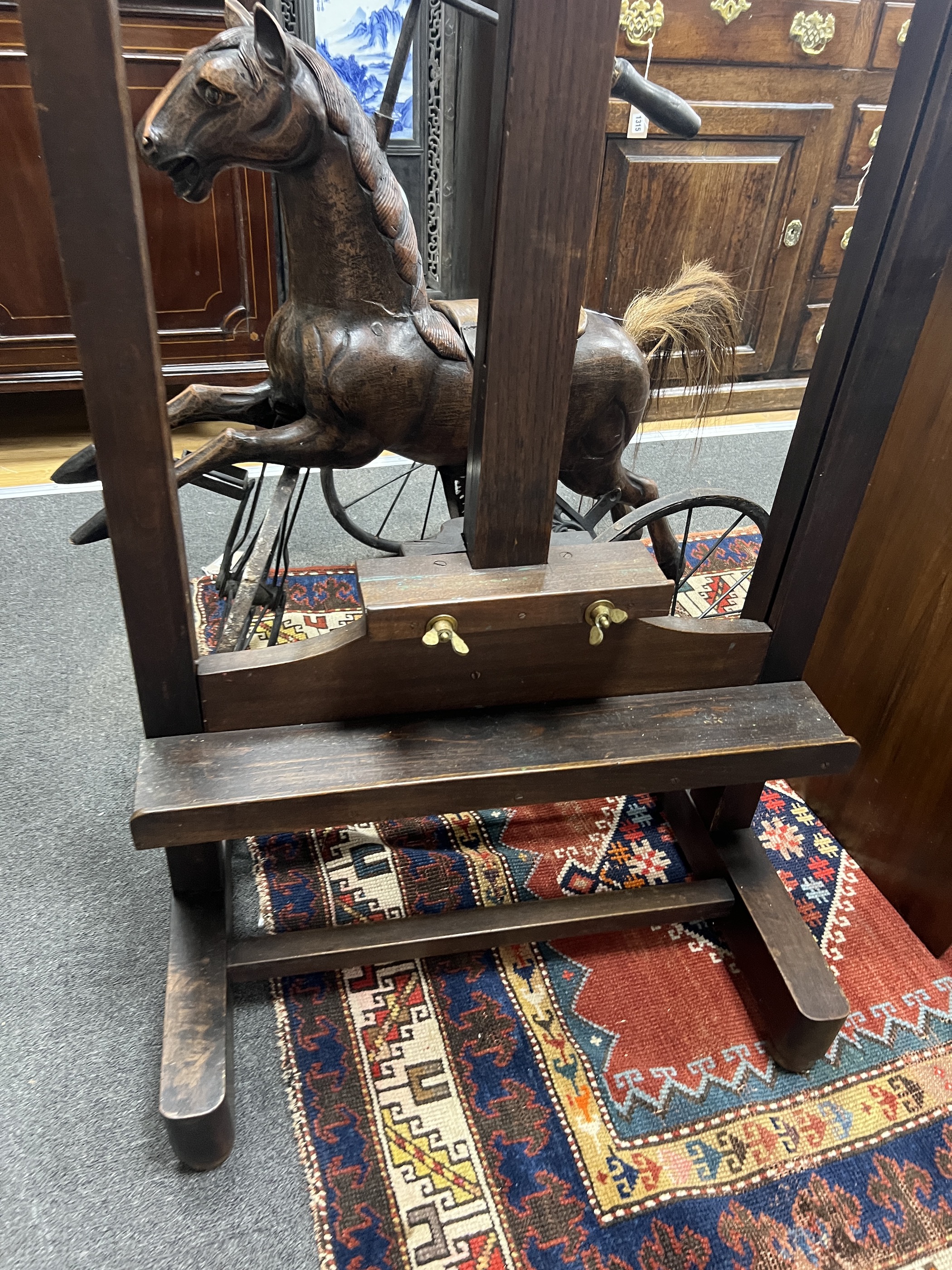 A late Victorian pine and beech artist's studio easel, width 62cm, height 180cm